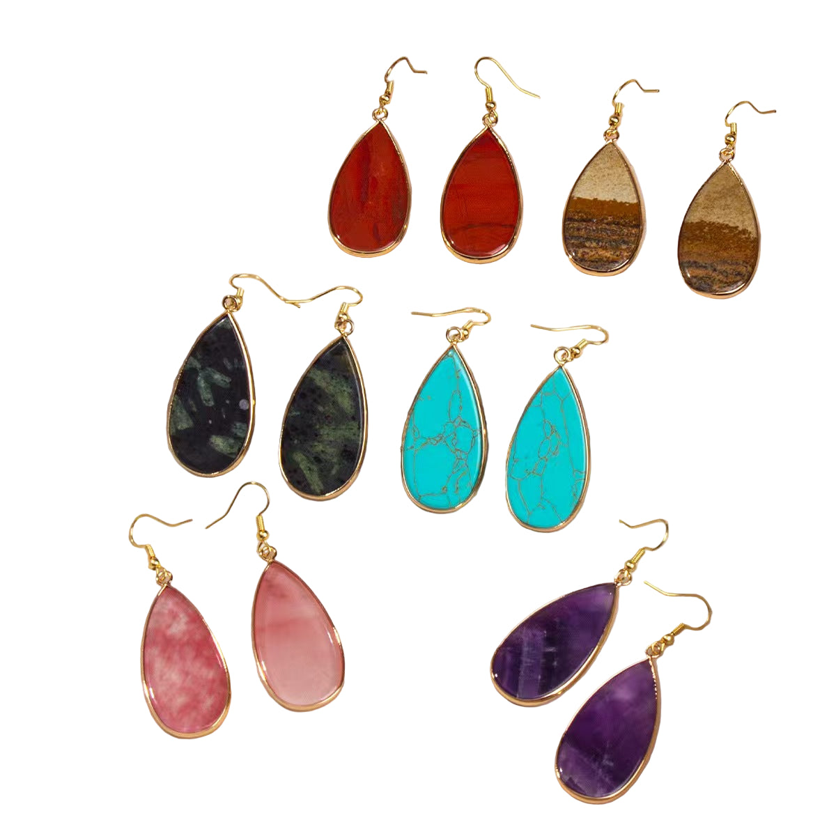 Set of colorful teardrop earrings in a jewelry box
