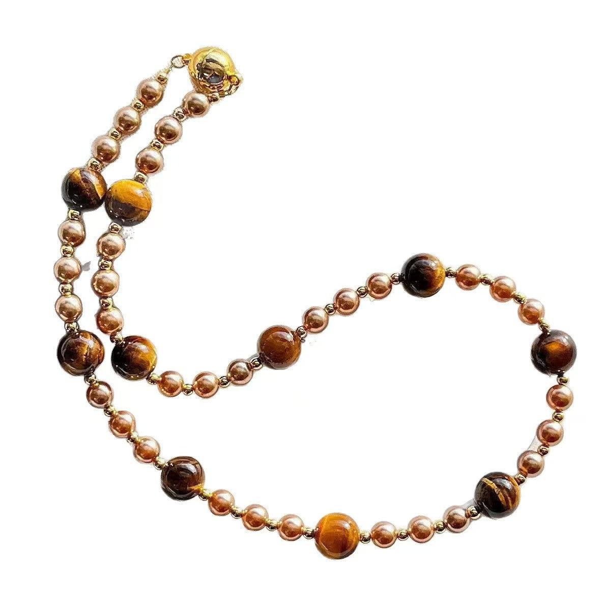 Necklace with brown and gold beads on a white background