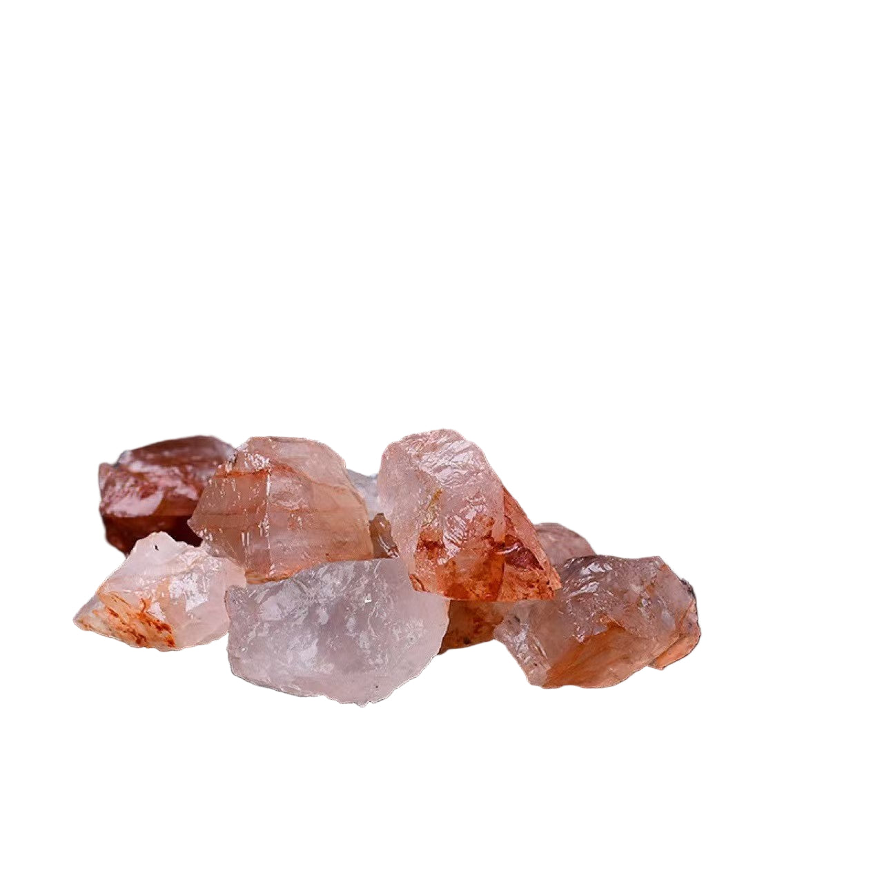 Raw pink crystals on a white surface