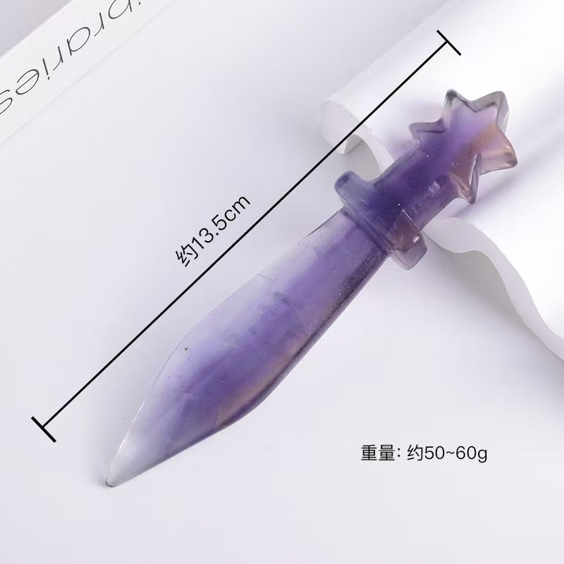 Purple and white object with star-shaped top on a white background