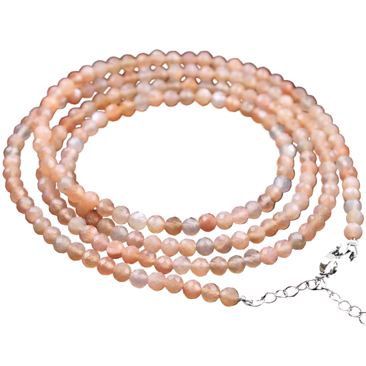 Necklace with pink and white pearls on a white background