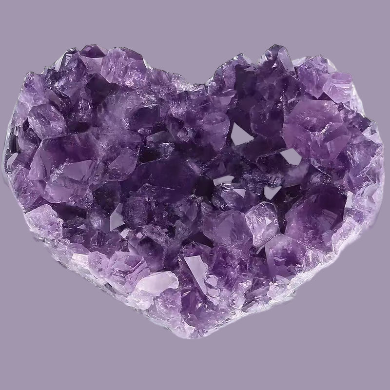 Amethyst crystal cluster on a gray background