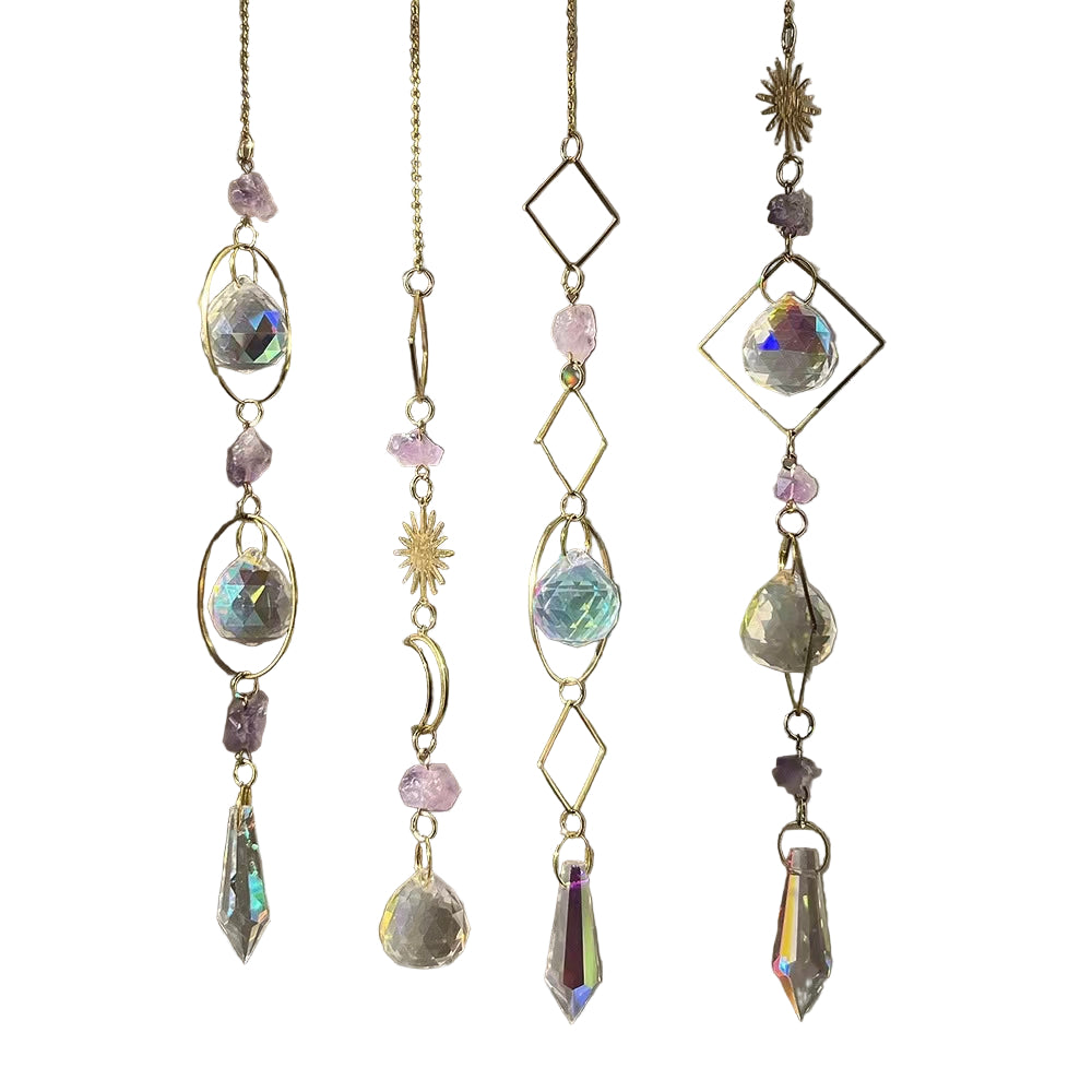 Crystal hanging decorations with gold chains on a blurred background