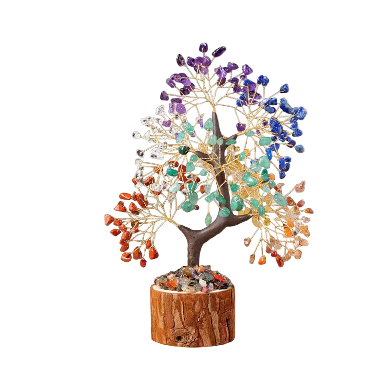 Decorative tree with multicolored stones on a wooden base in a home setting