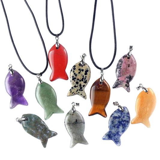 Collection of colorful stone fish pendants on black cords against a white background