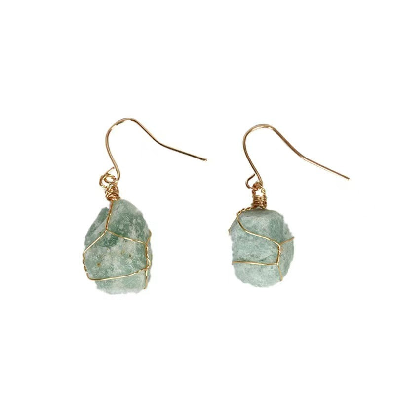 Green stone earrings with gold wire wrapping on a white background