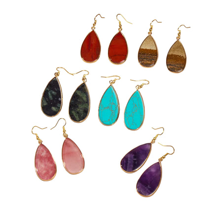 Set of colorful teardrop earrings in a jewelry box