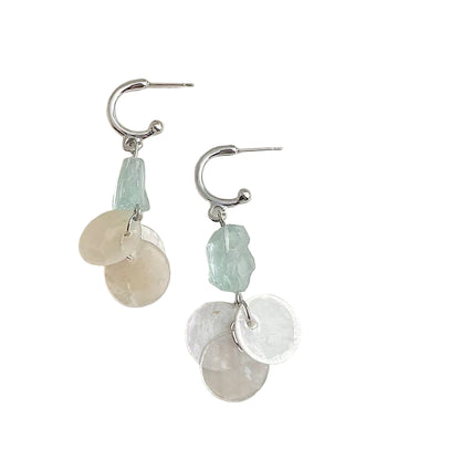 Pair of earrings with stone beads on a white background