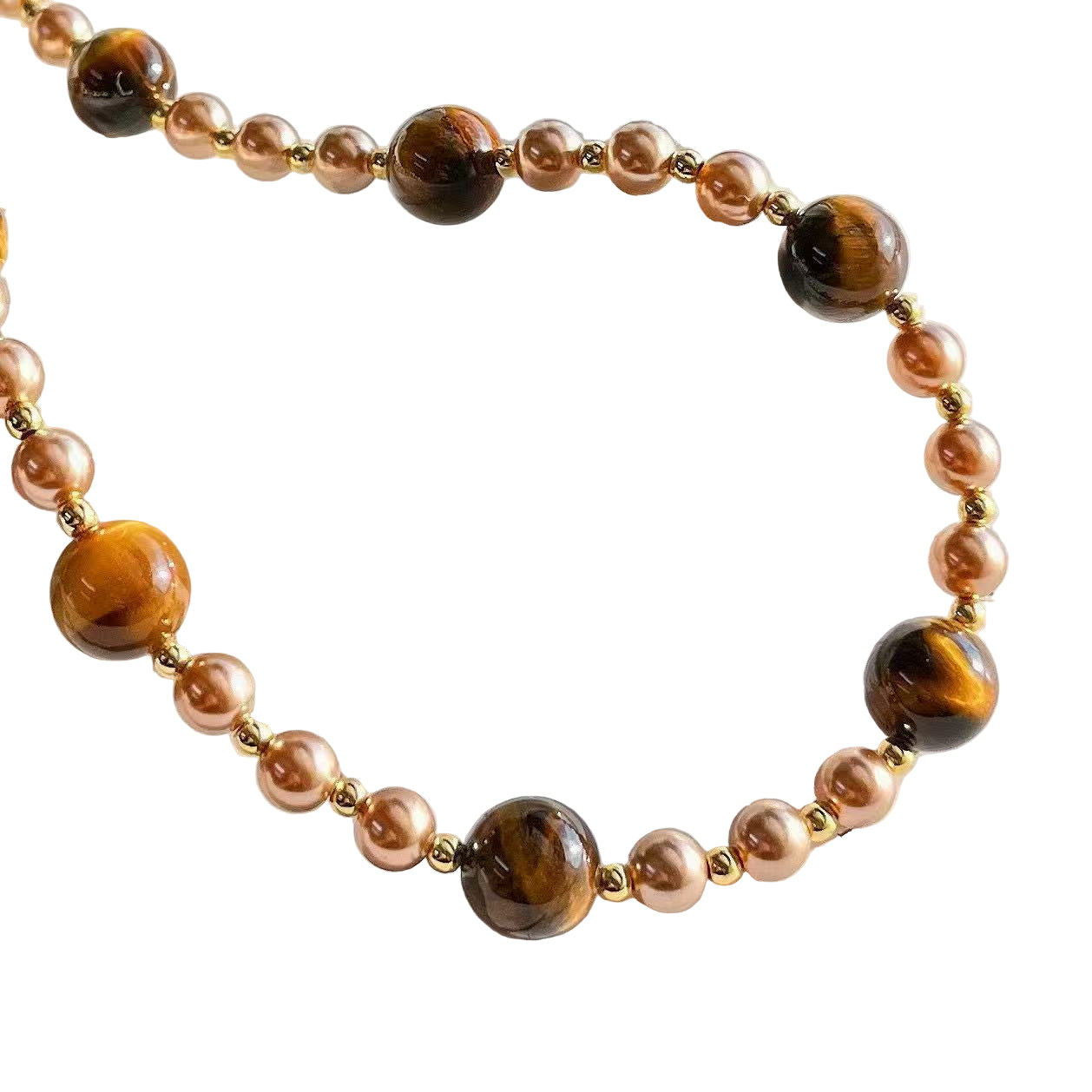 Necklace with brown and pink beads on a white 