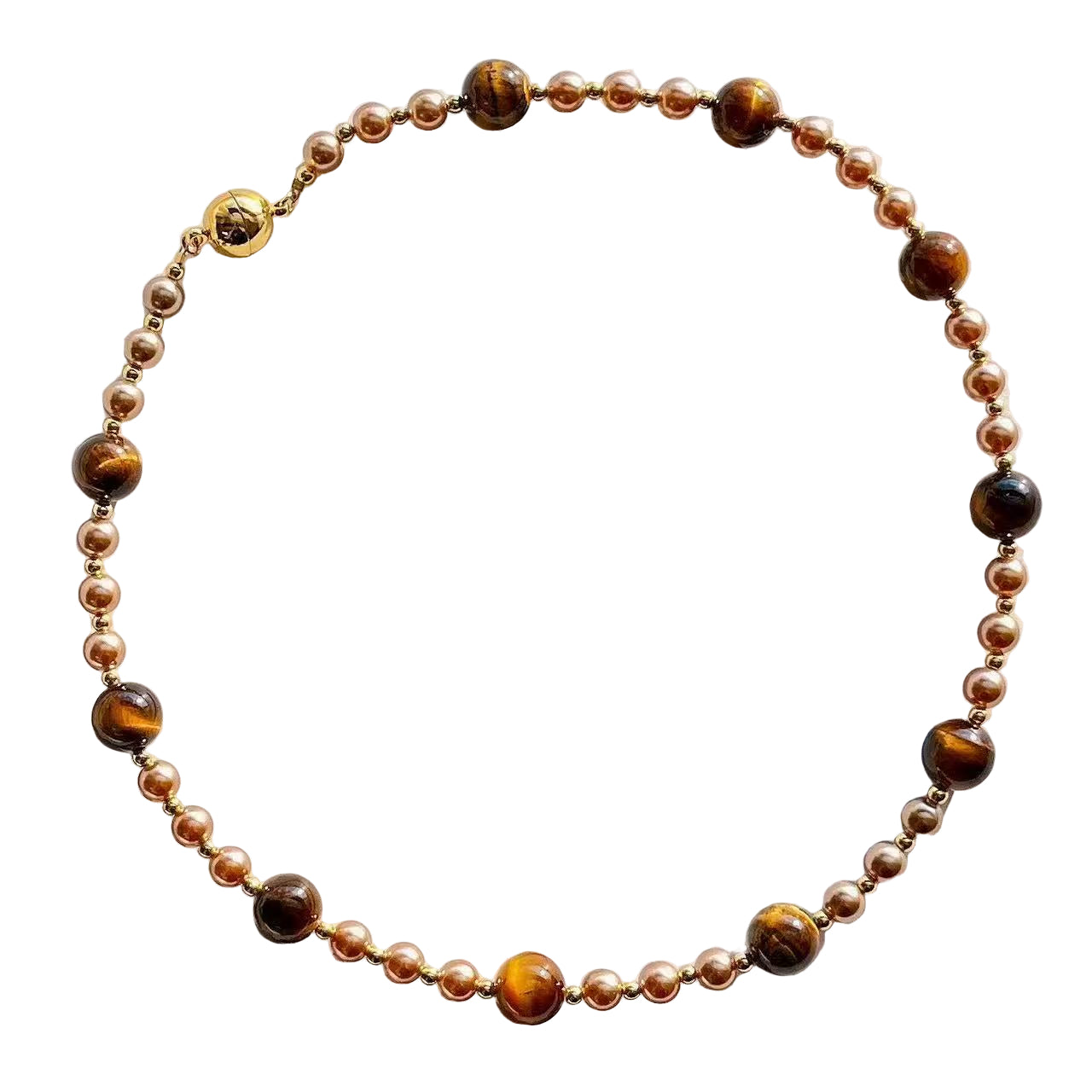 Necklace with brown and gold beads on a white background