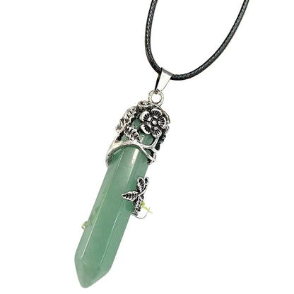 Green crystal pendant necklace with silver decorative elements on a white background
