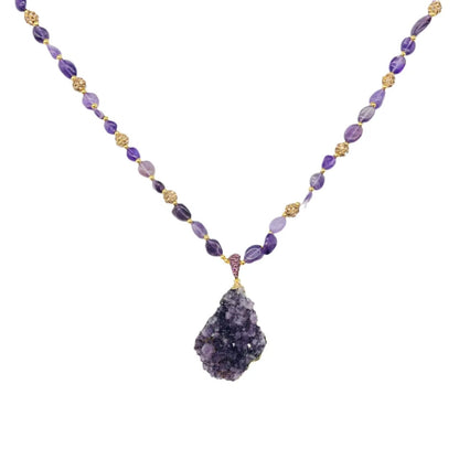 Necklace with purple gemstone pendant on a white background