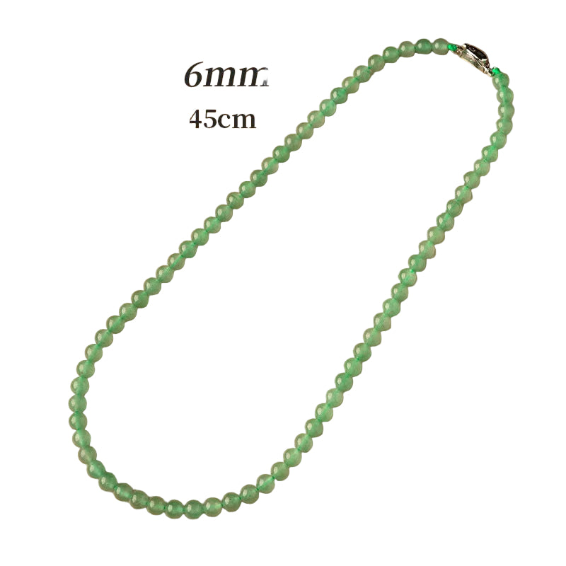 Green beaded necklace on a beige background with text indicating size.