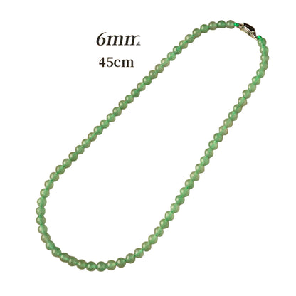 Green beaded necklace on a beige background with text indicating size.