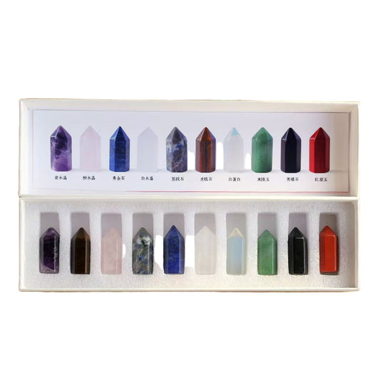 Set of colorful crystal points in a box with A peng Crystal Crafts branding on a whitesurface.