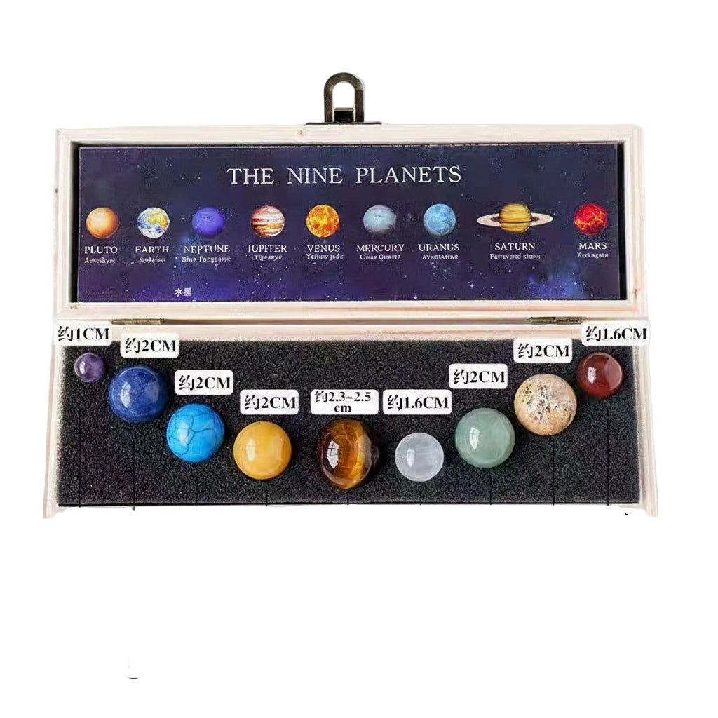 Model of the nine planets in a wooden box with labeled sizes on a white background