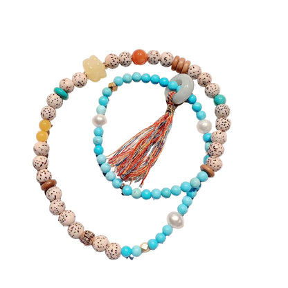 Beaded necklace with a tassel on a white  background