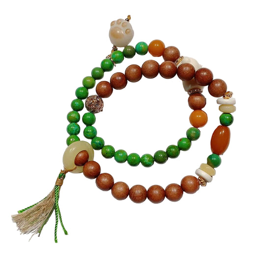 Beaded bracelet with green, brown, and gold beads on a white background