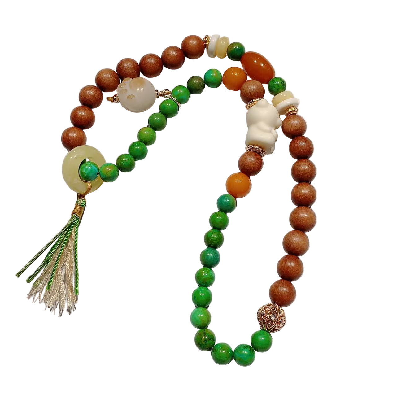 Beaded necklace with green, brown, and white beads on a light background