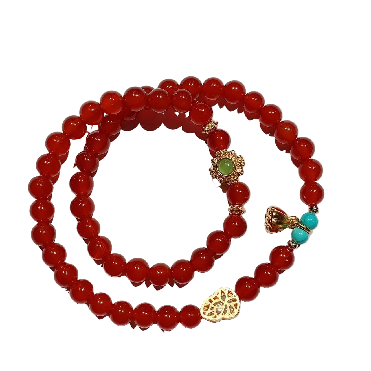 Red beaded bracelet with gold and turquoise charm on a white background