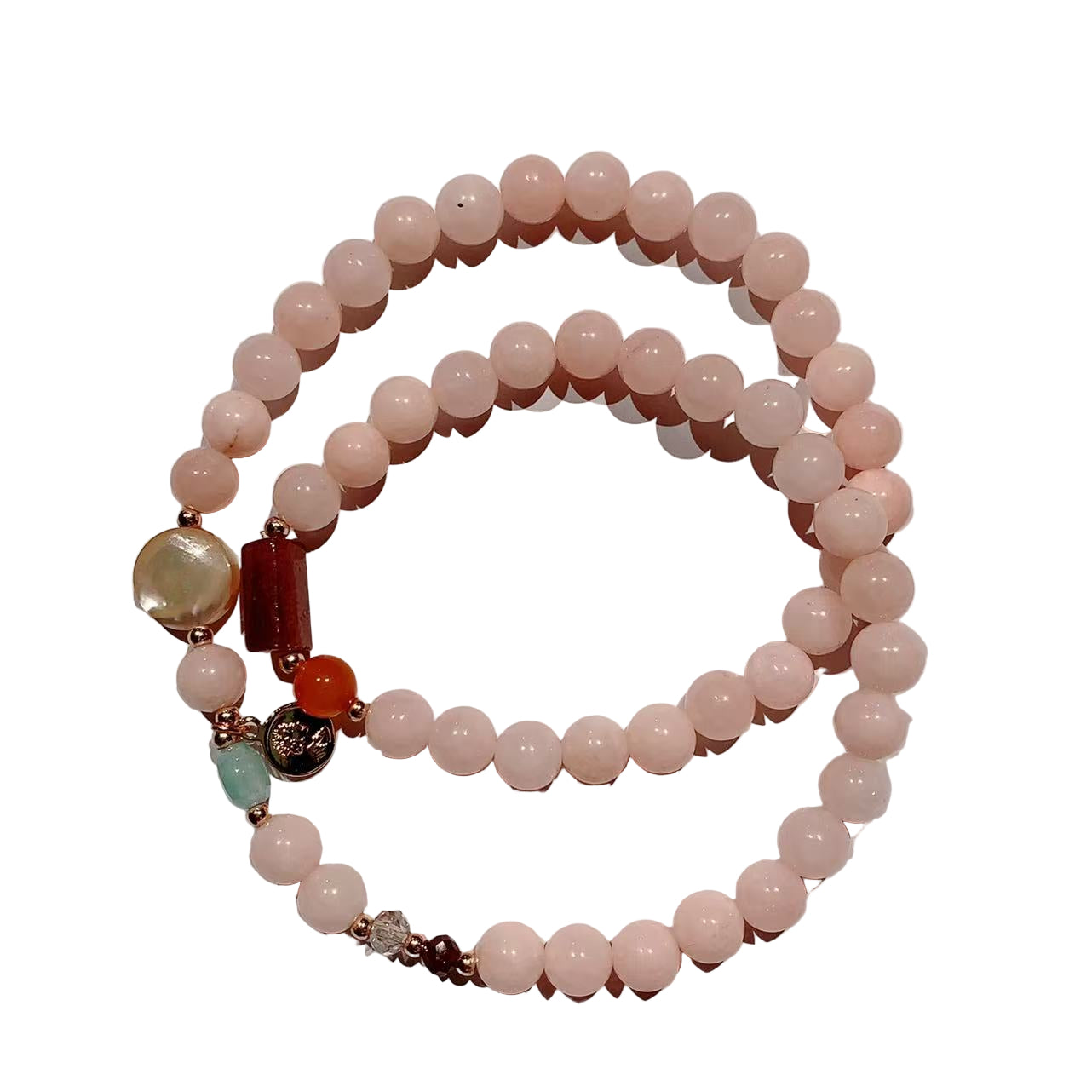 Beaded bracelet with pink beads and colorful accents on a white background