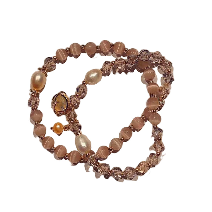 Beaded bracelet with pearls on a white  background