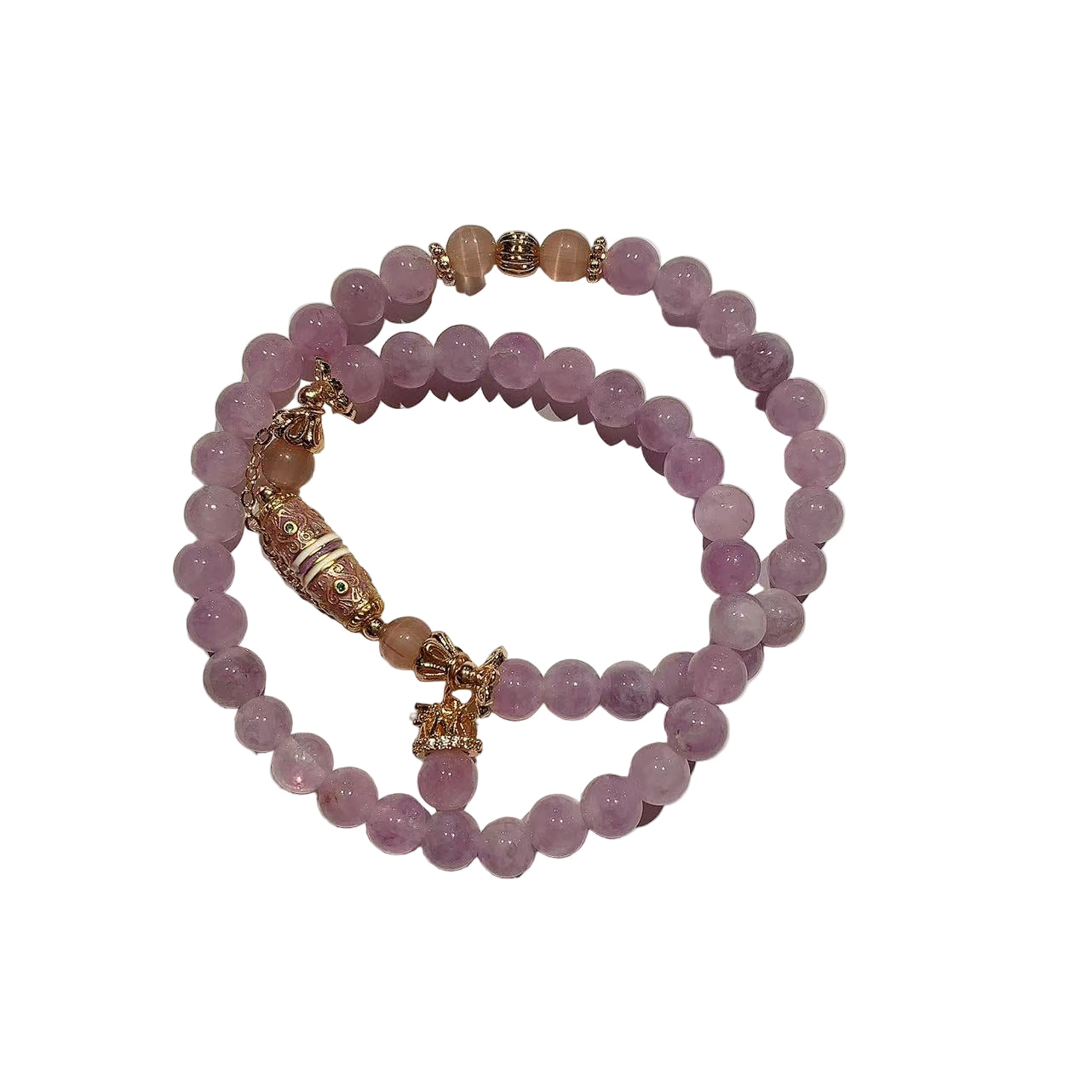 Stack of pink beaded bracelets with gold accents on a white background