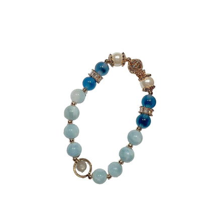 Beaded bracelet with blue and white beads on a white background