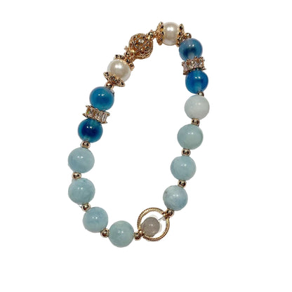 Beaded bracelet with blue and white beads on a white background