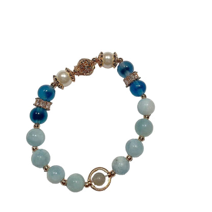 Beaded bracelet with blue and green beads on a white background