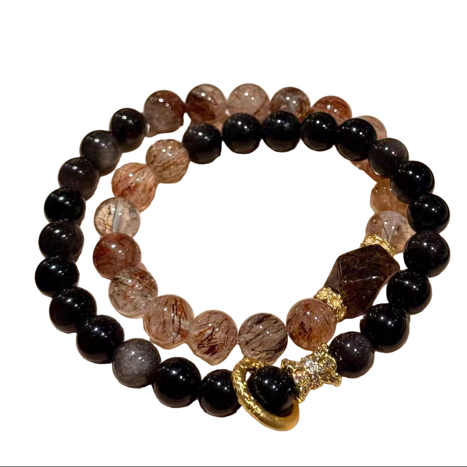 Set of beaded bracelets on a 'Best Wishes' card with alight background