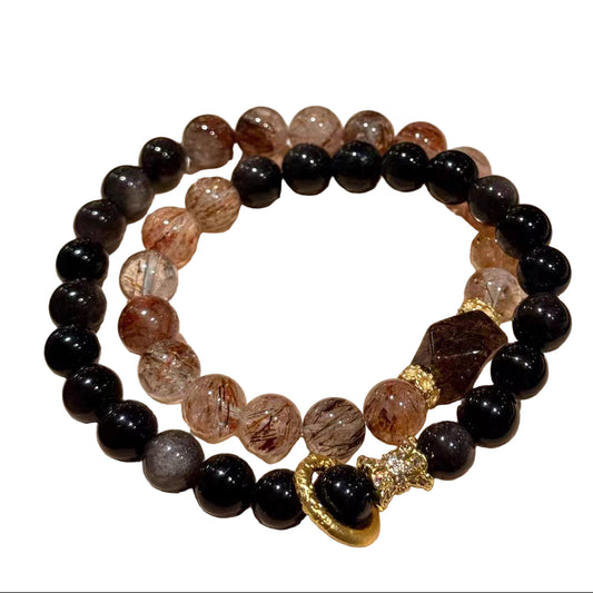 Set of beaded bracelets on a 'Best Wishes' card with alight background