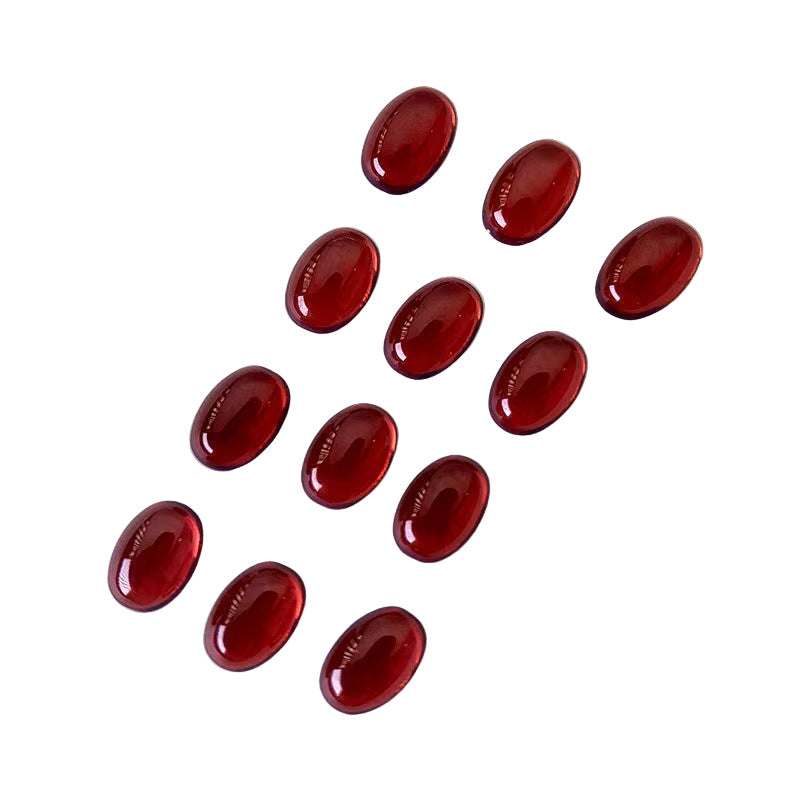 Red oval gemstones on a white background 