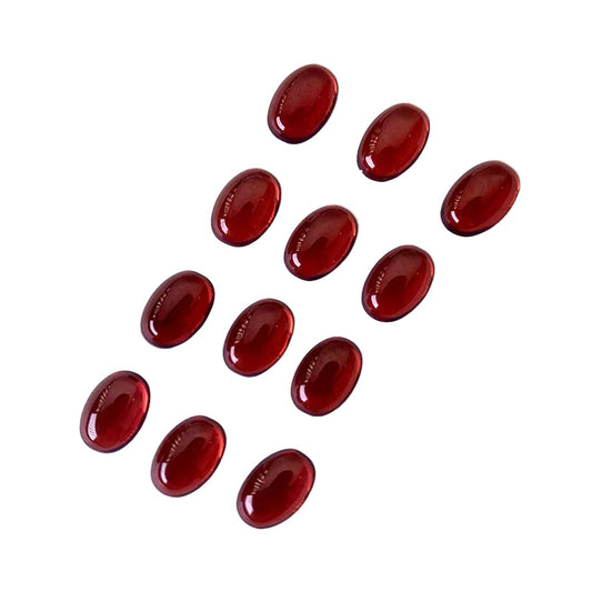 Red oval gemstones on a white background 