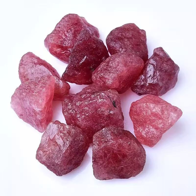 Raw red crystals on a white background
