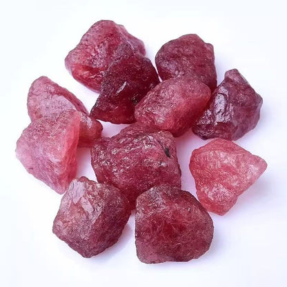 Raw red crystals on a white background