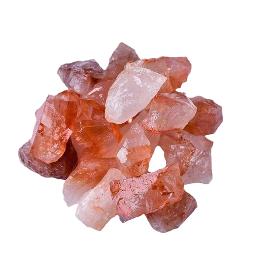 Cluster of pink and red crystals on a white background