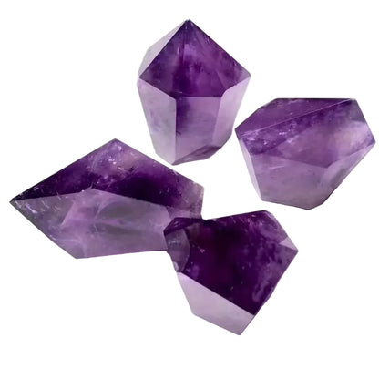 Four purple crystal stones on a white background