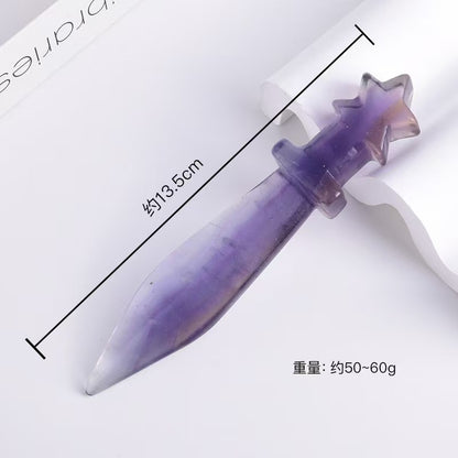 Purple and white object with star-shaped top on a white background