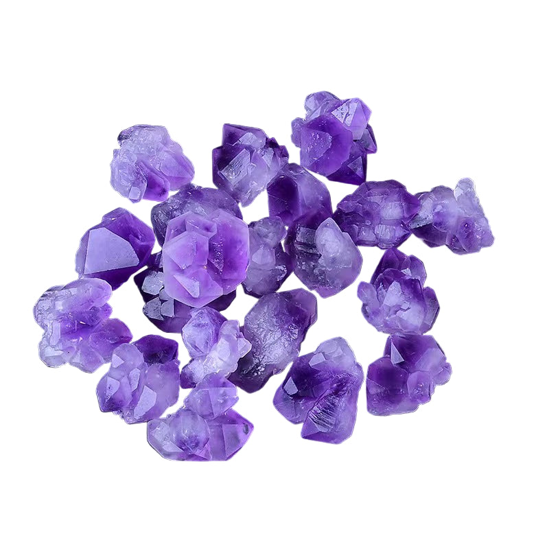 Purple crystal rocks on a white surface 