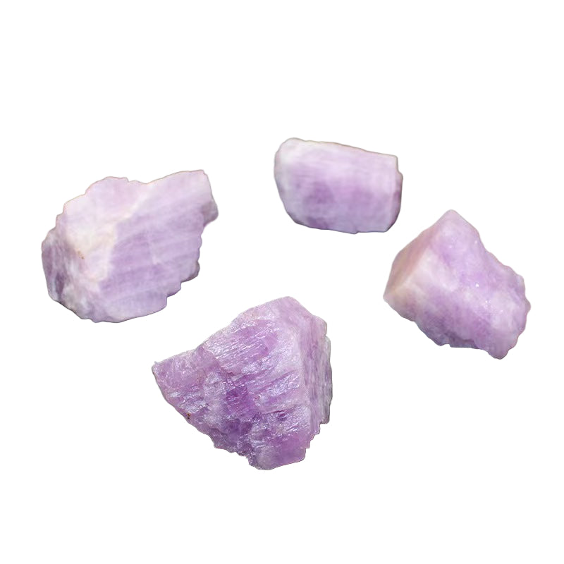 Four purple crystals on a dark gray surface