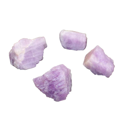 Four purple crystals on a dark gray surface