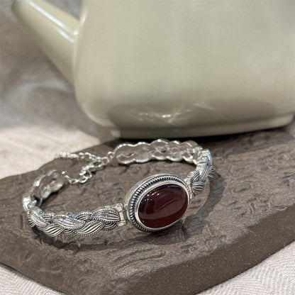 Antique Thai Silver Braided Twist Bracelet - Elegant Blood Amber Oval Cabochon, Vintage Ethnic Style Jewelry for Sophisticated Women
