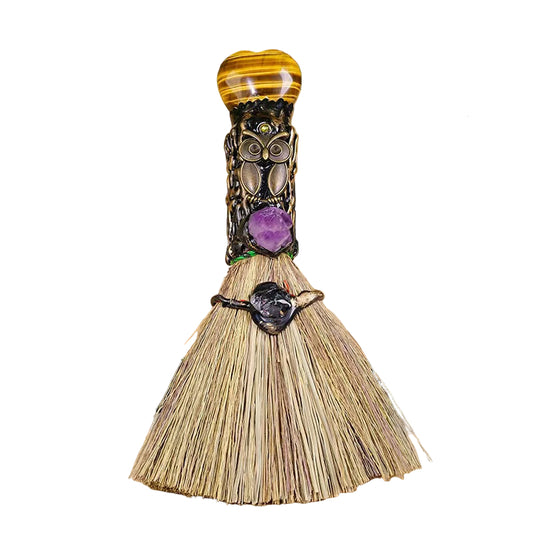 Decorative broom with crystal handle in white background
